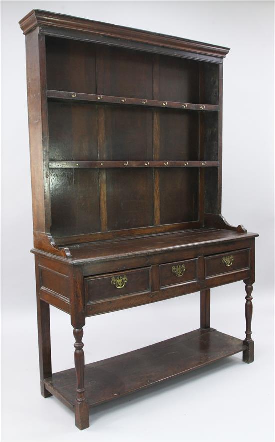 An 18th century style oak dresser, W.3ft 11in. D.1ft 6in. H.6ft 3in.